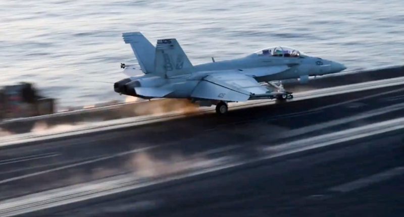 Aircraft launching from aircraft carrier.