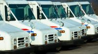 Line of postal delivery trucks.