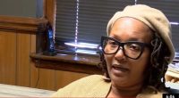 Woman expressing frustration over post office changes in Clio.