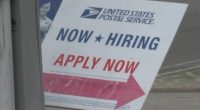 United States Postal Service hiring sign.