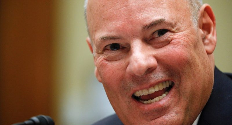 Close-up of Postmaster General Louis DeJoy testifying.