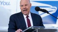 Louis DeJoy, Postmaster General of the United States, speaking at a news conference.