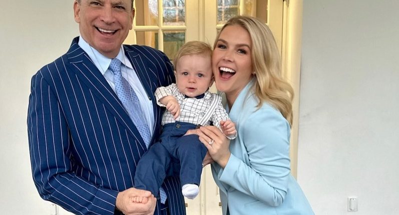 Karoline Leavitt with her husband and baby in front of the White House.