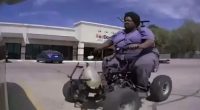 A large person on a three-wheeled ATV.