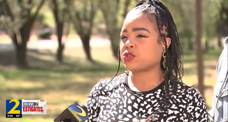 Woman being interviewed by a news reporter.