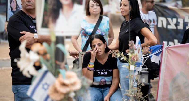 Mourners at a memorial for victims of the Hamas attack in Israel.