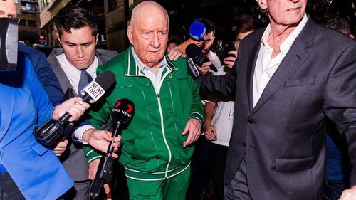 Alan Jones leaves Day Street Police Station on bail. Alan Jones was arrested at his Circular Quay apartment by NSW Police over allegations the controversial broadcaster and former Wallabies coach indecently assaulted, groped or inappropriately touched multiple young men. He is currently being held at Day Street Police Station. Media waiting outside. Monday 18th November 2024