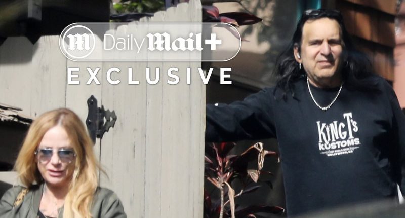80s rocker comforted by female pal after fiancée's cruise ship death