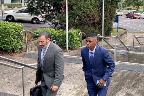 Soccer star Angel Torres (right) has gone on trial accused of rape, intimidation and assault.