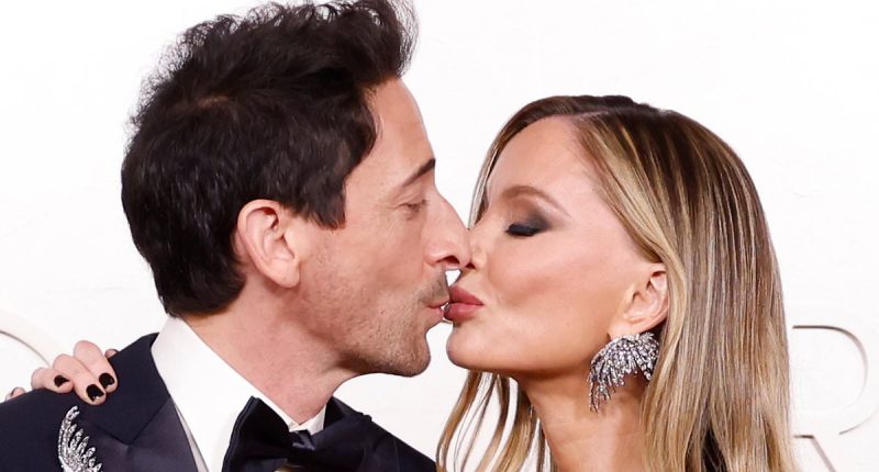 Adrien Brody plants a kiss on Georgina Chapman at Oscars 2025