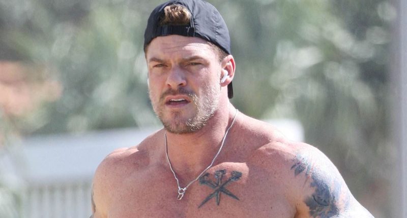 Alan Ritchson shows off his bulging muscles on the Gold Coast