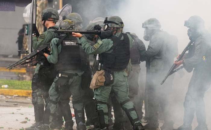 Argentine retirees and soccer fans clash with police during protests against austerity measures