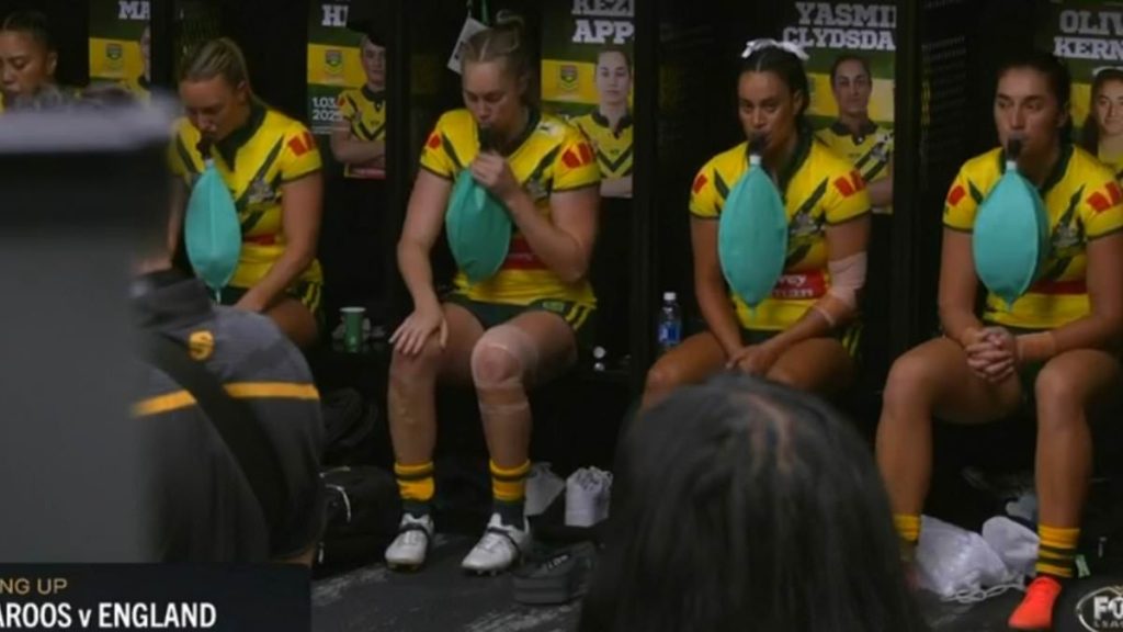 Australia's women's footy team are caught on camera using BALLOONS in truly bizarre scenes in their locker room in Las Vegas