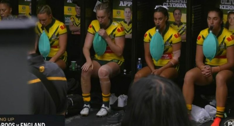Australia's women's footy team are caught on camera using BALLOONS in truly bizarre scenes in their locker room in Las Vegas