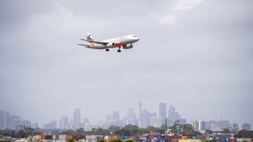 A plane takes off from Sydney Airport.