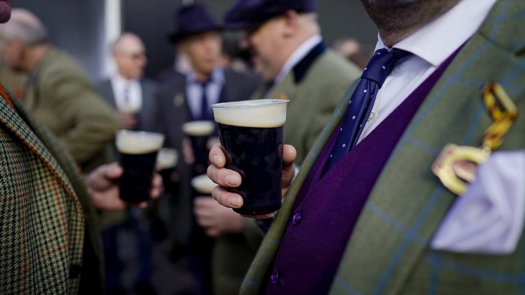 Cheltenham racegoers set to drink '380k pints of Guinness' with Irish stout 'expected to make £3m' as online trend of 'splitting the G' surges