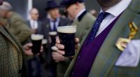 Cheltenham racegoers set to drink '380k pints of Guinness' with Irish stout 'expected to make £3m' as online trend of 'splitting the G' surges