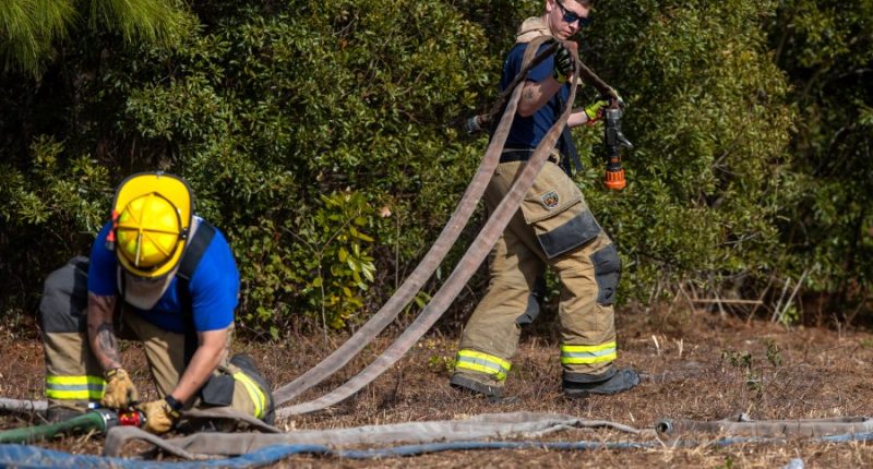 Crews battle wildfires in North and South Carolina amid dry conditions and gusty winds