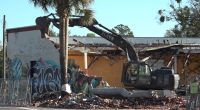 Demolition crews in Springfield clear condemned building following sudden collapse