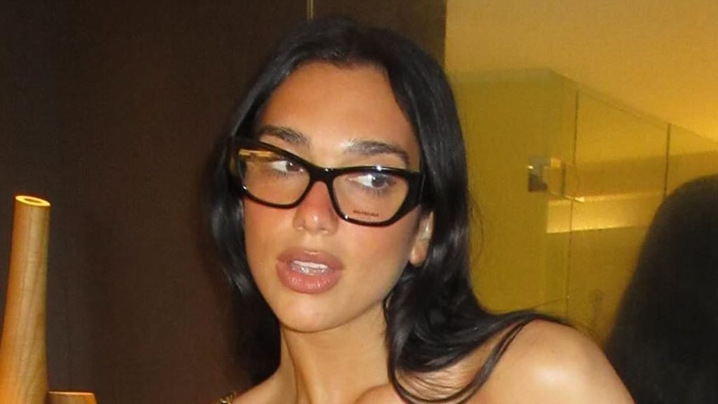 Dua Lipa exudes glamour in strapless mini dress as she gives fans a glimpse into 'life Down Under' during her sold-out Australia tour