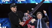 Elon Musk holds a chainsaw handed to him by Argentine President Javier Milei, behind, at the Conservative Political Action Conference (CPAC) in Oxon Hill, Maryland, Feb. 20, 2025. (AP Photo/Jose Luis Magana)