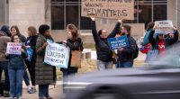 Fired Department of Education employees clean out desks