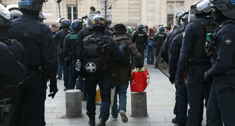 French riot cops clash with migrants as they FINALLY clear Paris theatre occupied by hundreds of homeless asylum seekers who were invited to a free show and stayed for weeks