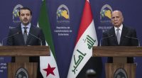 Syrian Foreign Minister Asaad al-Shaybani, left, speaks during a news conference with his Iraqi counterpart Fouad Hussein following their meeting, in Baghdad, Iraq, Friday, March.14, 2025. (AP Photo/Hadi Mizban)