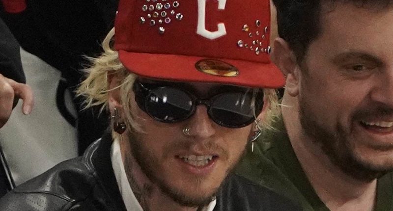 Machine Gun Kelly cheers on the Cleveland Cavaliers as he enjoys a night out ahead of welcoming baby with ex Megan Fox