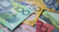 Australian money background showing $100, $50 and $20 notes with a shallow depth of field.
