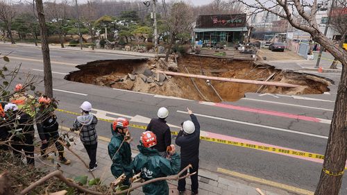 Motorcyclist who fell into Seoul sinkhole found dead after search