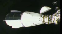 This image made from video by NASA shows the docking of the SpaceX capsule to the International Space Station.