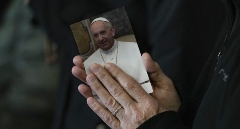 A nun attends a Rosary prayer for Pope Francis, in St. Peter's Square at the Vatican, Monday, March 10, 2025. (AP Photo/Andrew Medichini)