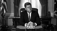 Newly-elected President Kennedy posed for first pictures at his White House desk, Jan. 21, 1961.