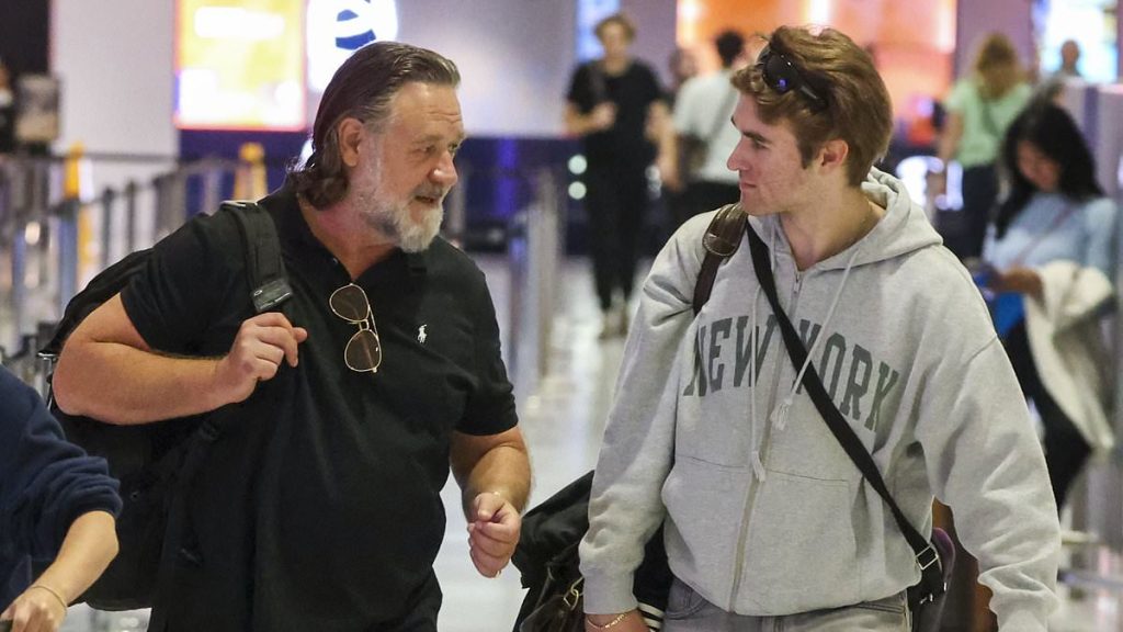 Russell Crowe shows off slimmed down look as he leaves Sydney