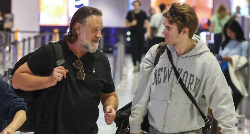 Russell Crowe shows off slimmed down look as he leaves Sydney