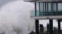 Schools are closed and public transport has stopped as rare cyclone approaches Australian coast