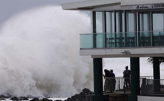 Schools are closed and public transport has stopped as rare cyclone approaches Australian coast