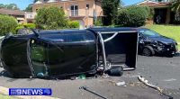 A search is under way for a father who pulled his children from a vehicle and fled a collision at Menai in Sydney's south.Witnesses raced to the rescue of a woman stuck in one car before emergency services took over.