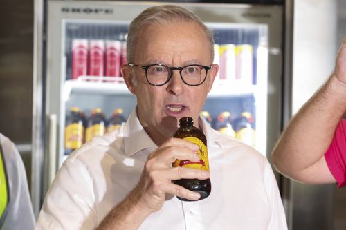 Prime Minister Anthony Albanese drinks a ginger beer during a visit to Bundaberg Brewed Drinks, in Bundaberg, Queensland, in the electorate of Hinkler, on Saturday 29 March 2025, during the 2025 federal election campaign. fedpol Photo: Alex Ellinghausen