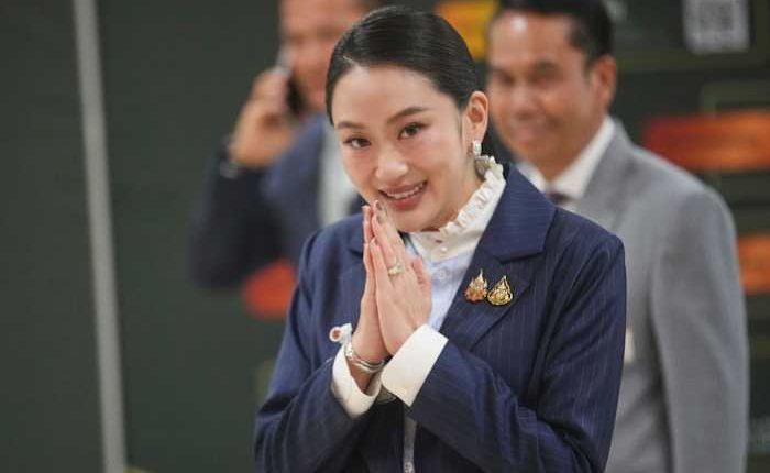 Thai prime minister survives a challenge by rivals who say her father is pulling the strings