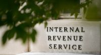 The IRS is drafting plans to cut as much as half of its 90,000-person workforce, AP sources say