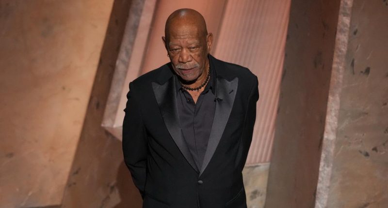 The story behind Morgan Freeman’s glove at the Oscars