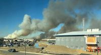 Wind-driven brush fire on New York's Long Island 50 percent contained. Firefighter injured