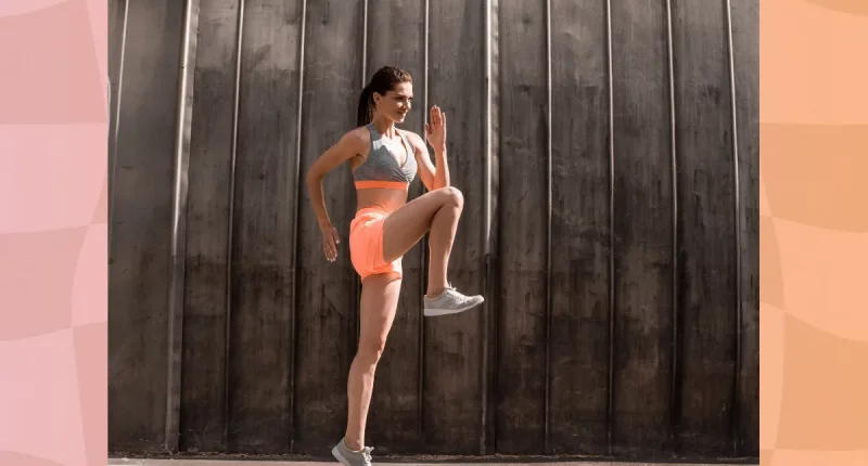 woman doing high knees exercise outdoors