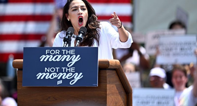 Alexandria Ocasio-Cortez speaking at a rally.