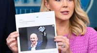 White House Press Secretary Karoline Leavitt holds a news article stating that Amazon partnered with a Chinese propaganda arm.