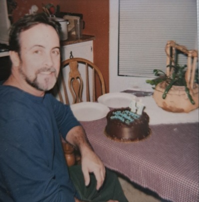 John William Cannon at a table with a birthday cake.