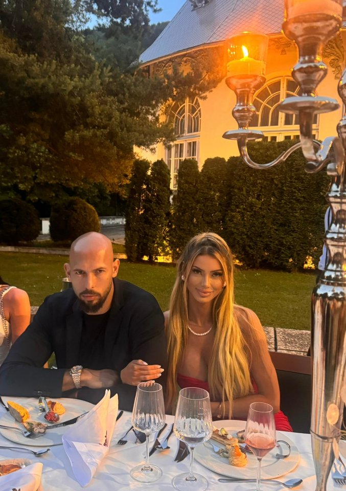 Bri Stern and Andrew Tate at an outdoor dinner.