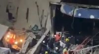 Rescue workers at the scene of a nightclub ceiling collapse.